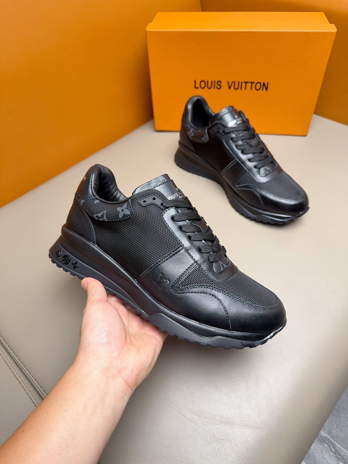 Louis Vuitton Black Leather & Mesh Sneakers — model