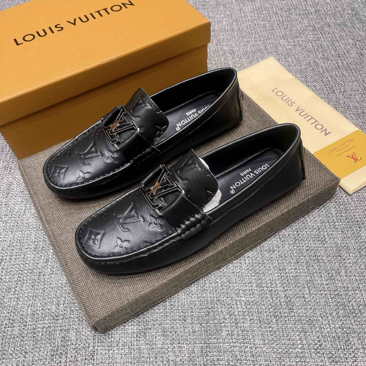 Louis Vuitton Black Metal-Accent Loafers — front