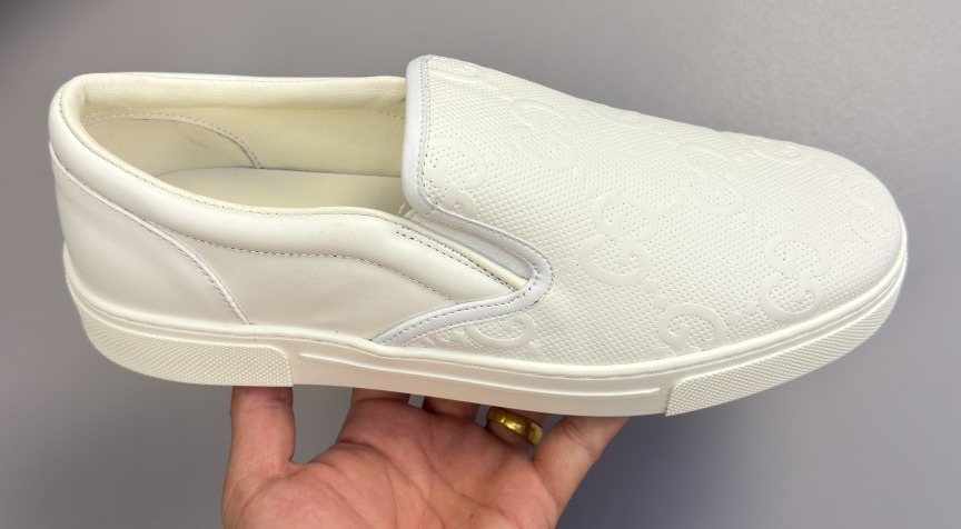 Ivory White Embossed Slip-On Sneakers — front