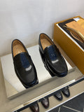 Tod's Glossy Dark Navy Penny Loafers — hero