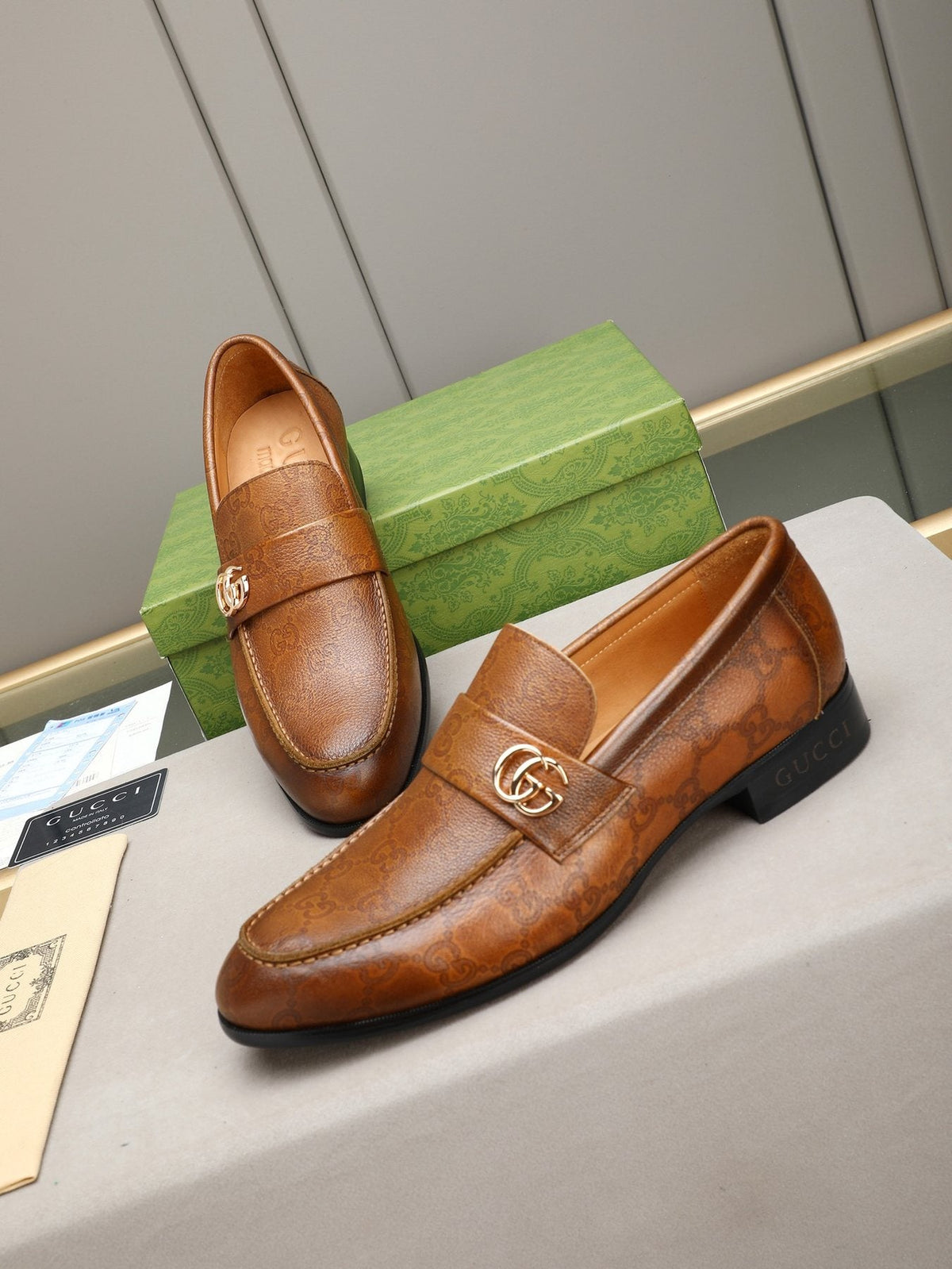 Gucci Brown Monogram Hardware Loafers — front