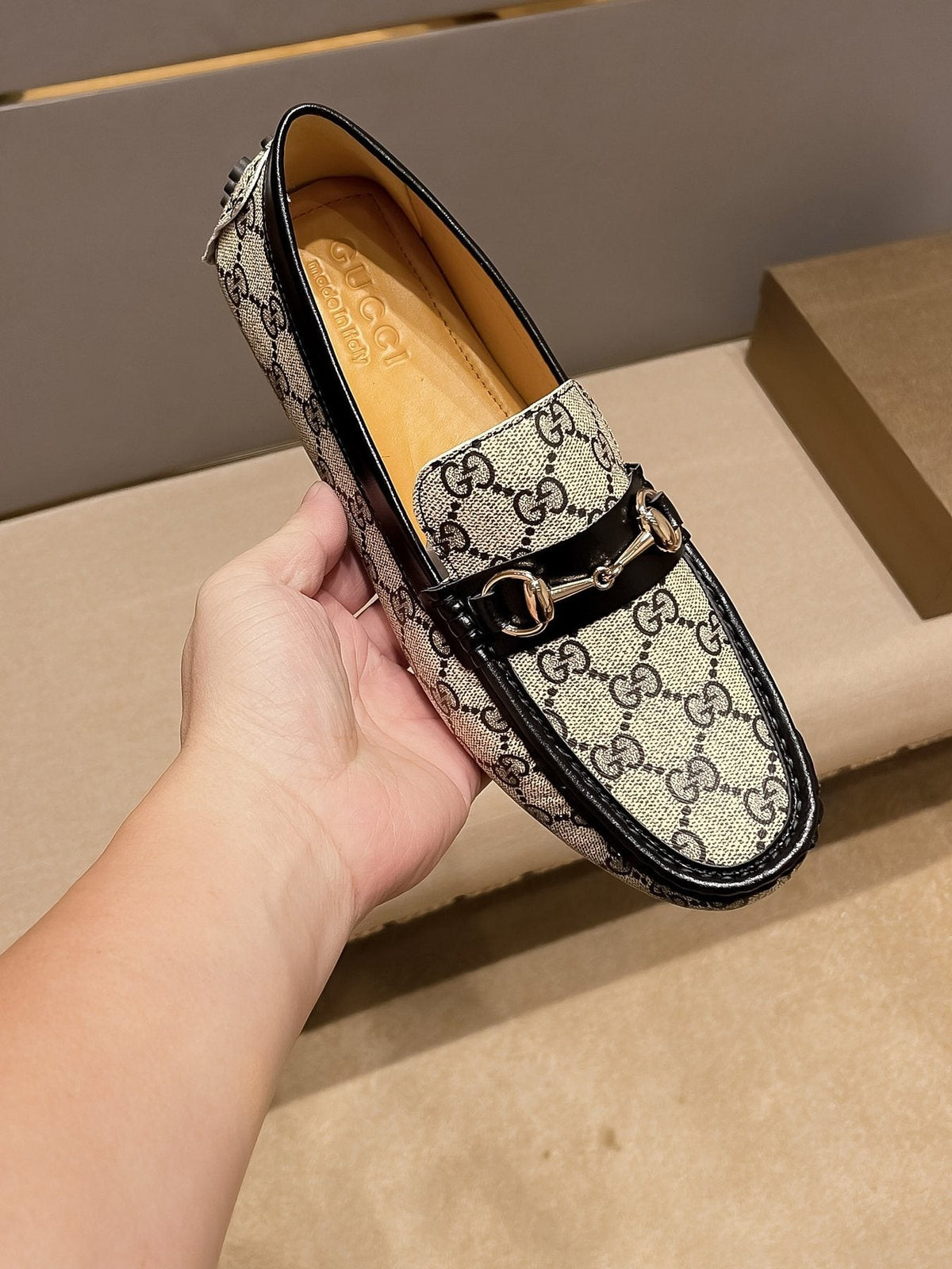 Gucci Beige and Black Gold-Hardware Loafers — front