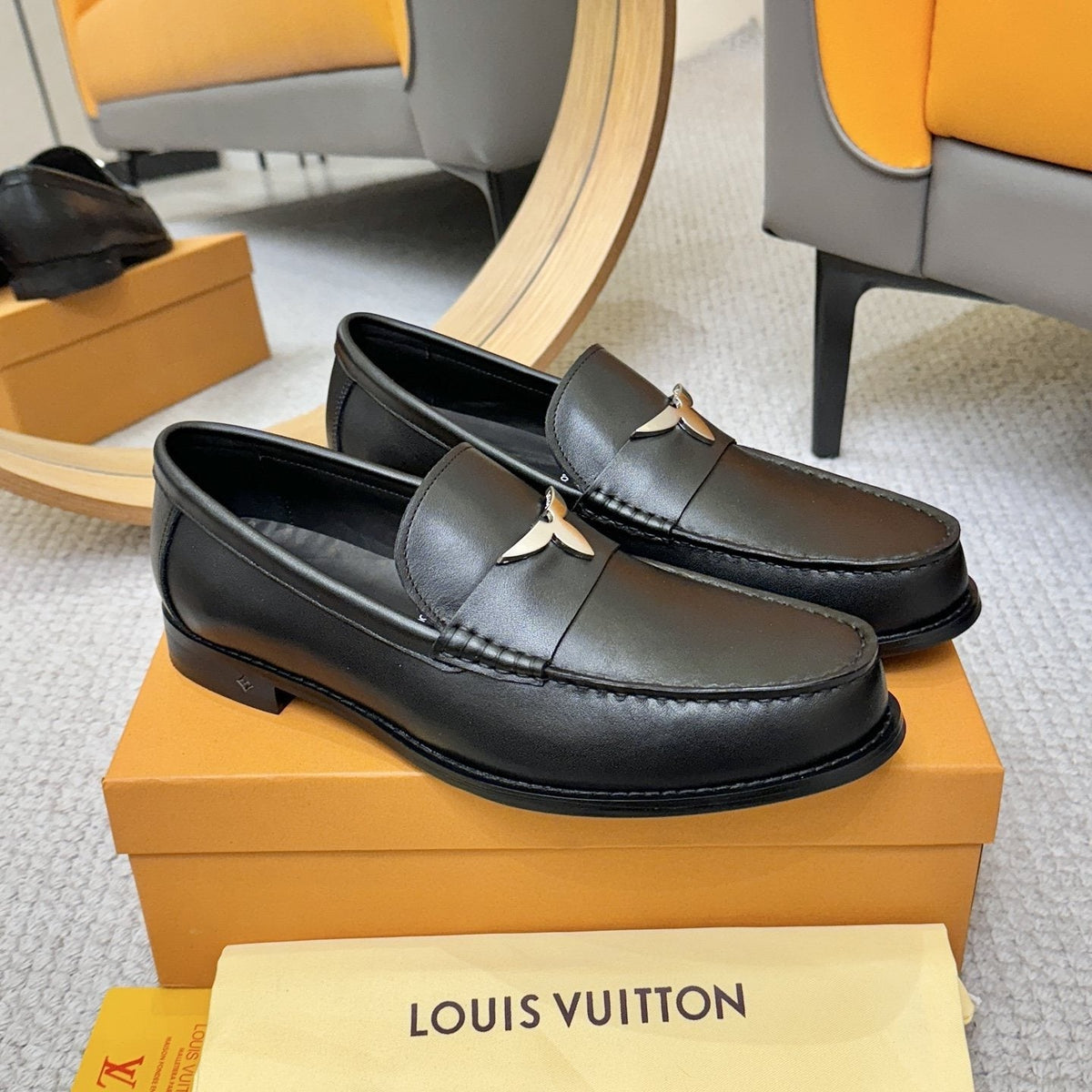 Louis Vuitton Black Metal-Accent Loafers — hero