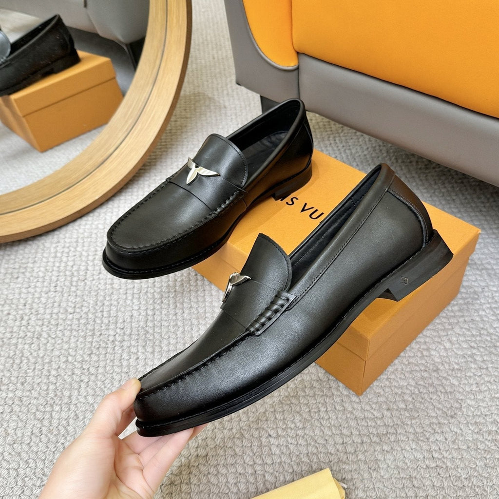 Louis Vuitton Black Metal-Accent Loafers — model