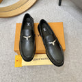 Louis Vuitton Black Metal-Accent Loafers — front