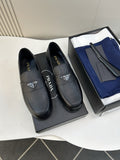 Prada Black Triangular Plaque Loafers — hero