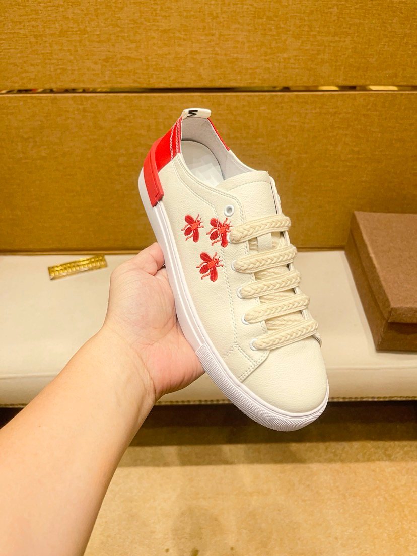 White Low-Top Sneakers with Red Floral Accents — model