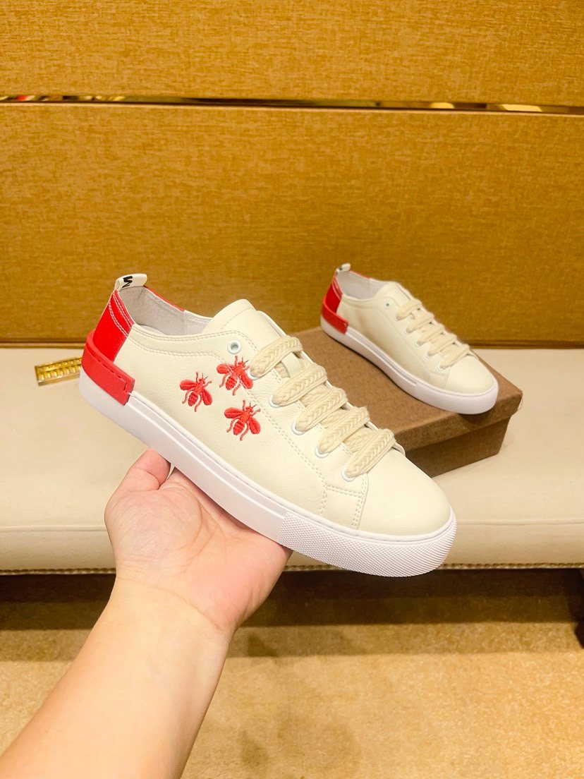 White Low-Top Sneakers with Red Floral Accents — model