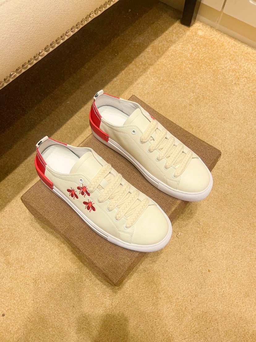 White Low-Top Sneakers with Red Floral Accents — front