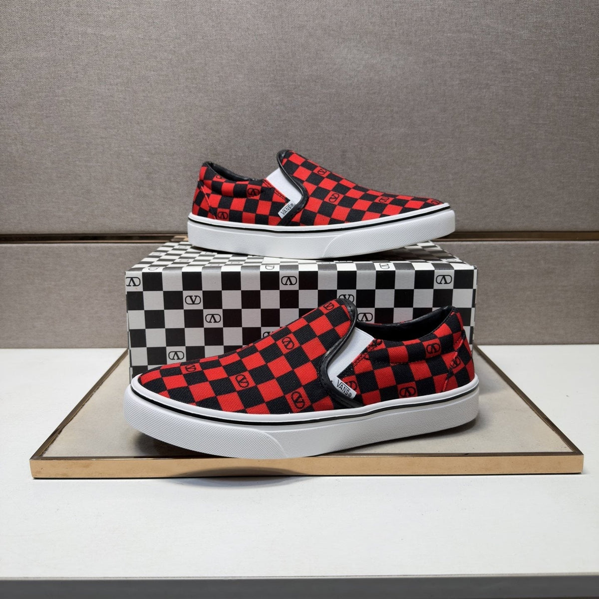 Vans Red and Black Checkerboard Slip-On Sneakers — front