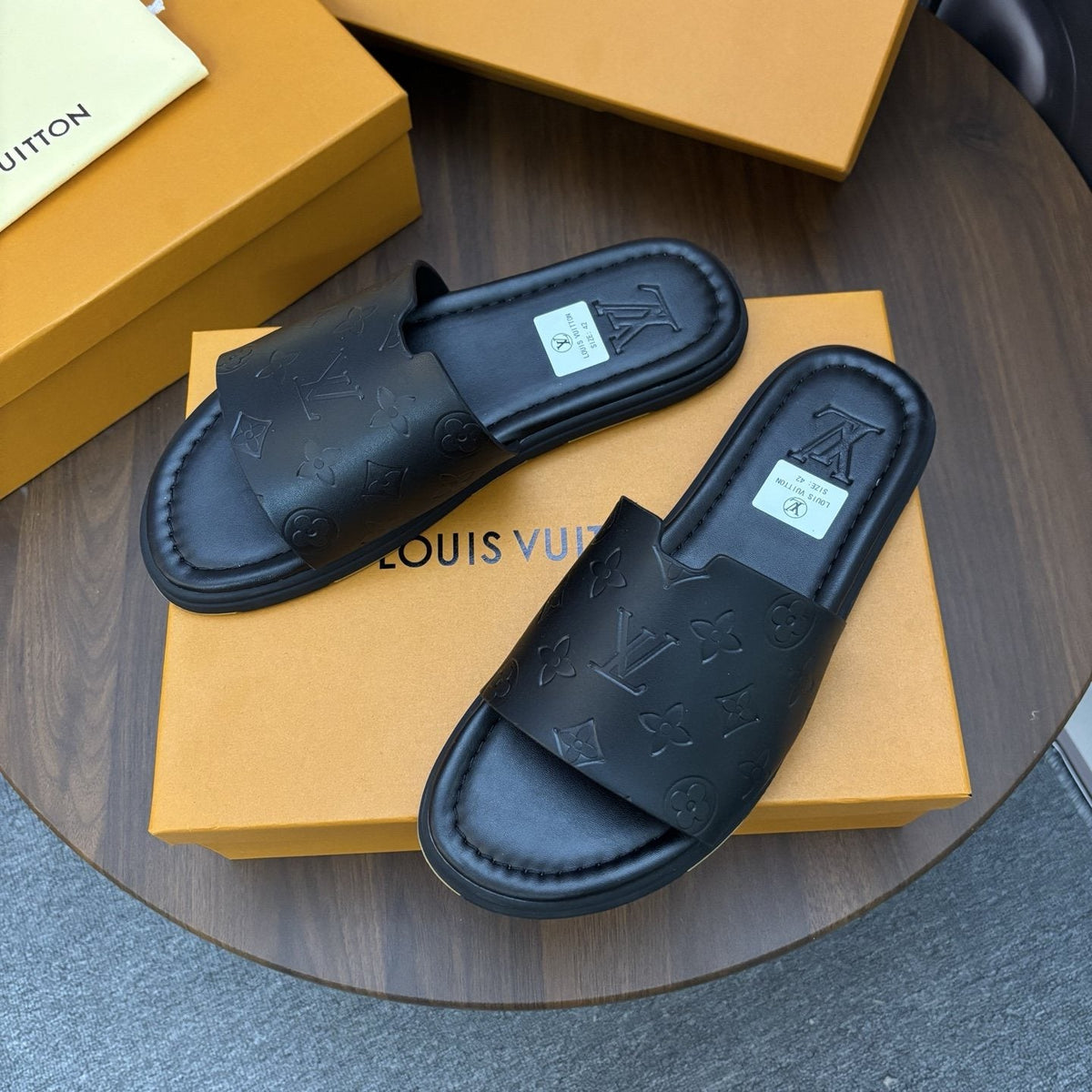Louis Vuitton Black Embossed Slide Sandals — front