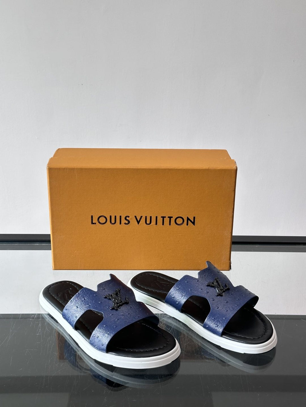 Louis Vuitton Embossed Blue Slide Sandals — front