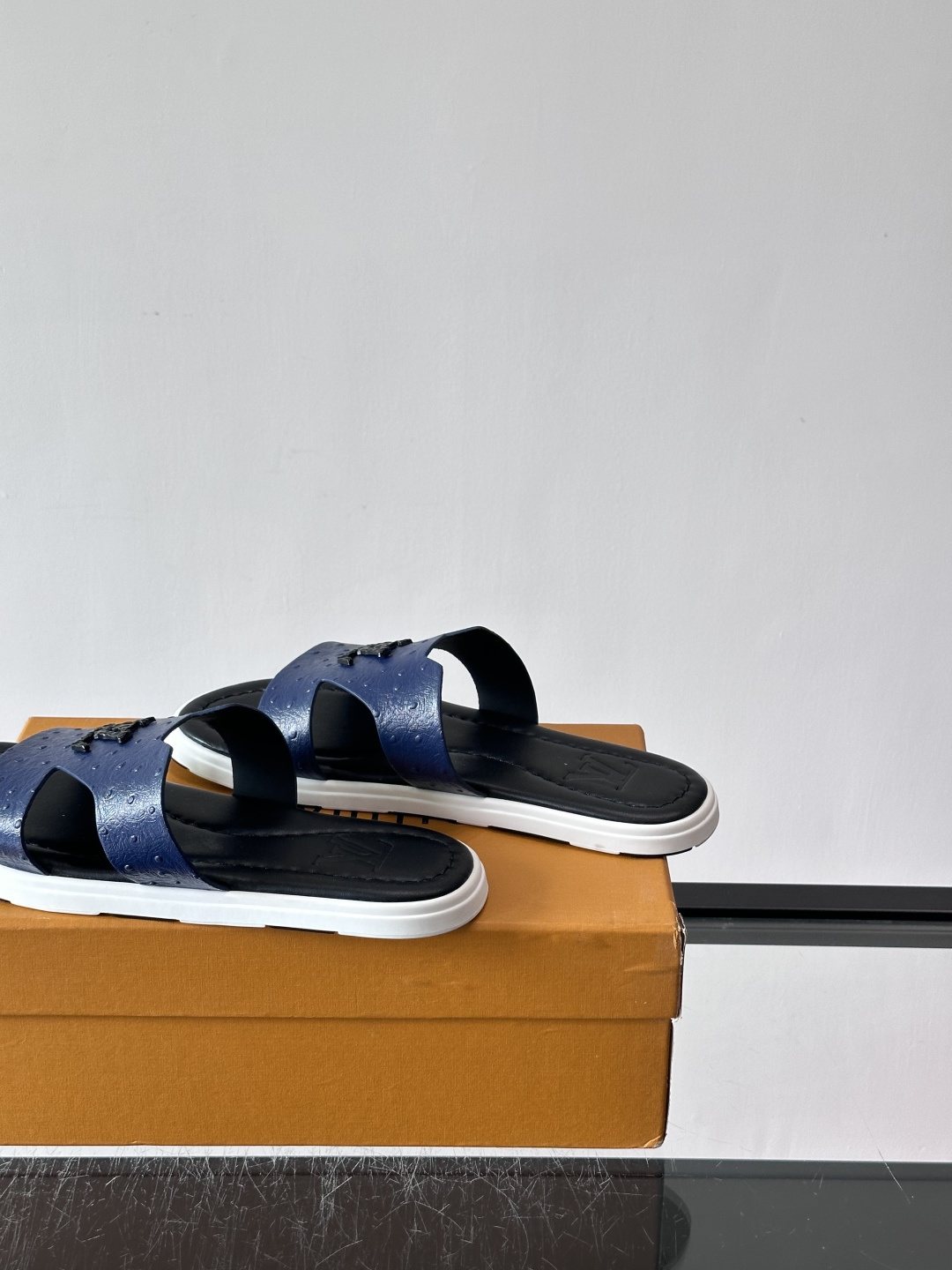 Louis Vuitton Embossed Blue Slide Sandals — side