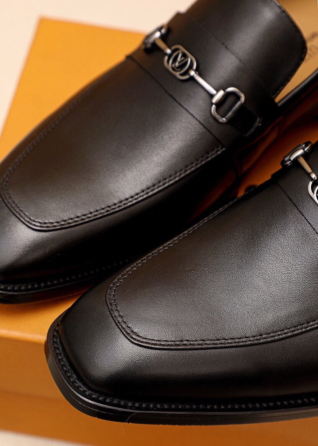 Louis Vuitton Black Metal-Bit Leather Loafers — detail