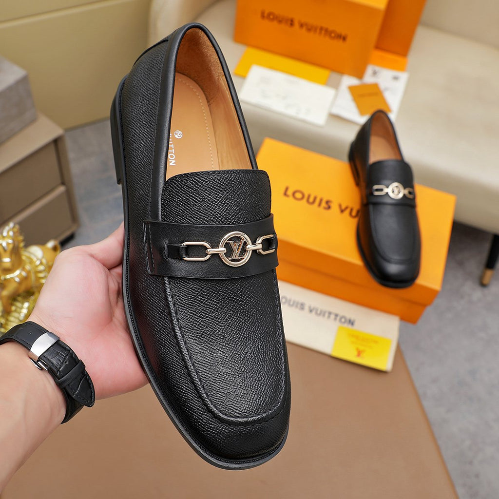 Louis Vuitton Black Metal-Link Loafers — model