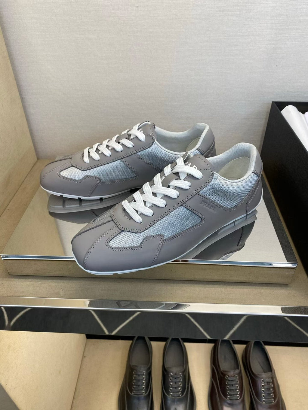 Prada Gray and White Low-Top Sneakers — side