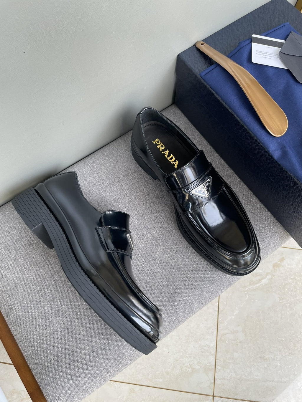PRADA Black Glossy Plaque Loafers — hero