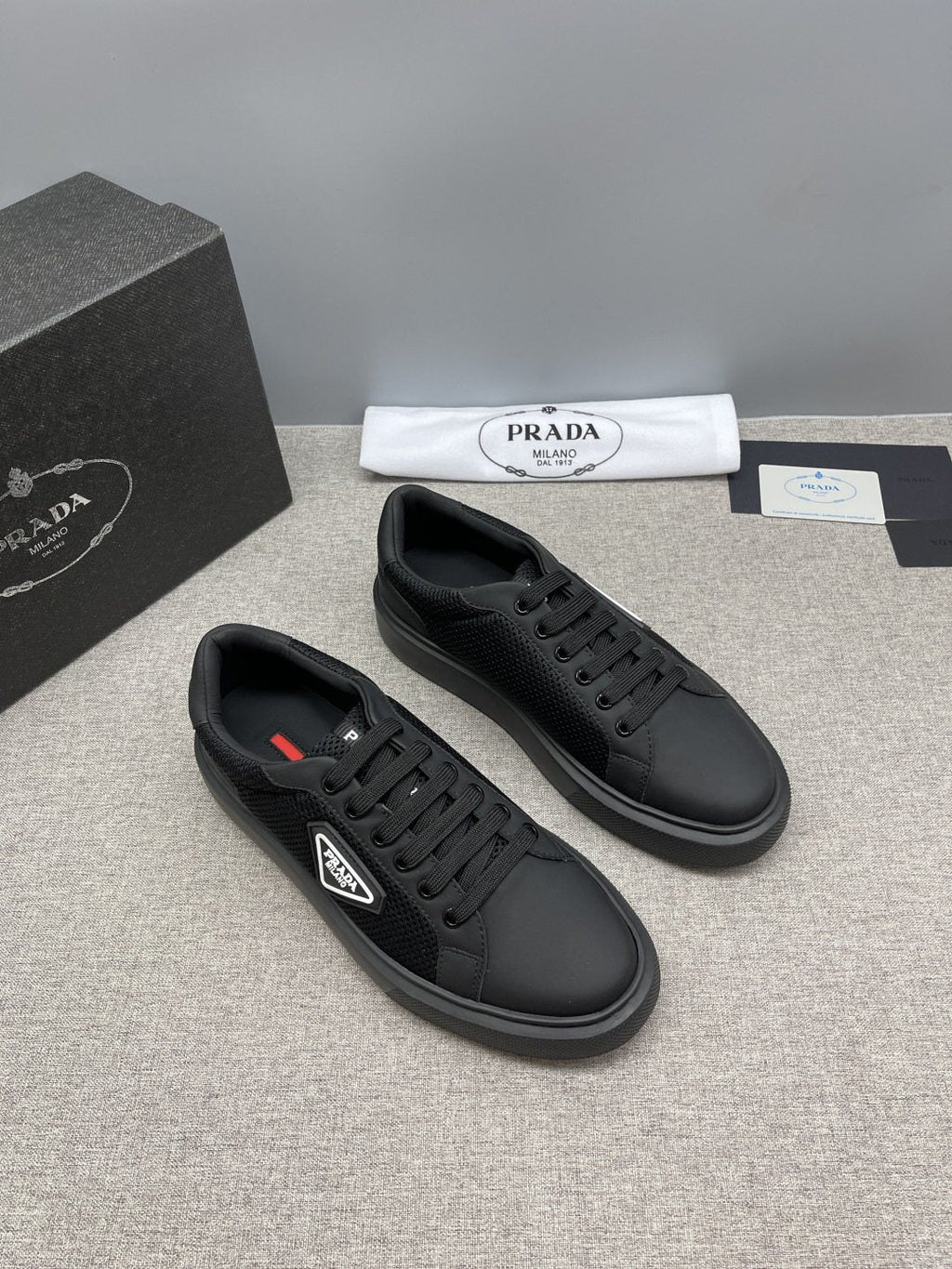 Prada Triangle Patch Low-Top Sneakers — front
