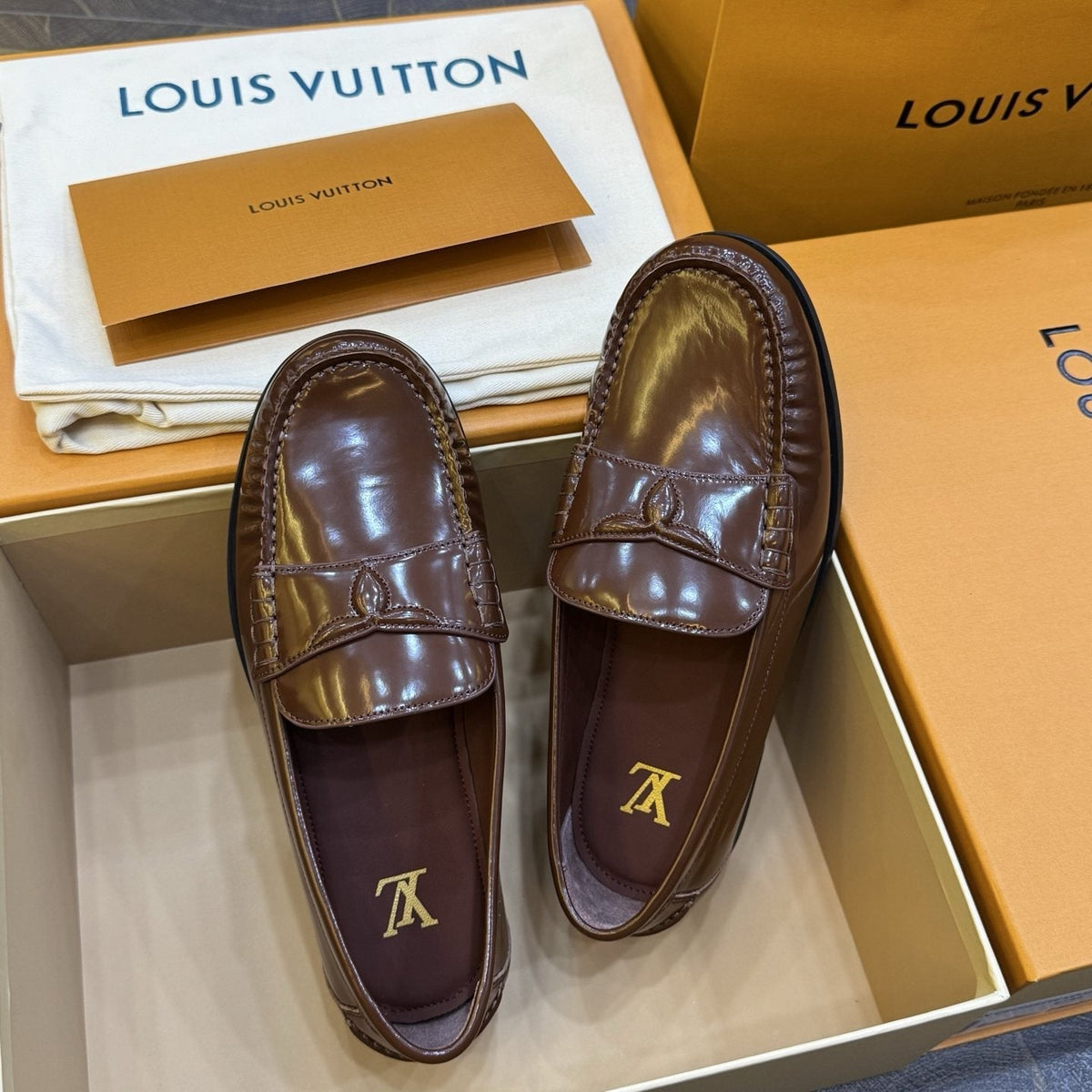 Louis Vuitton Brown Penny Loafers — front