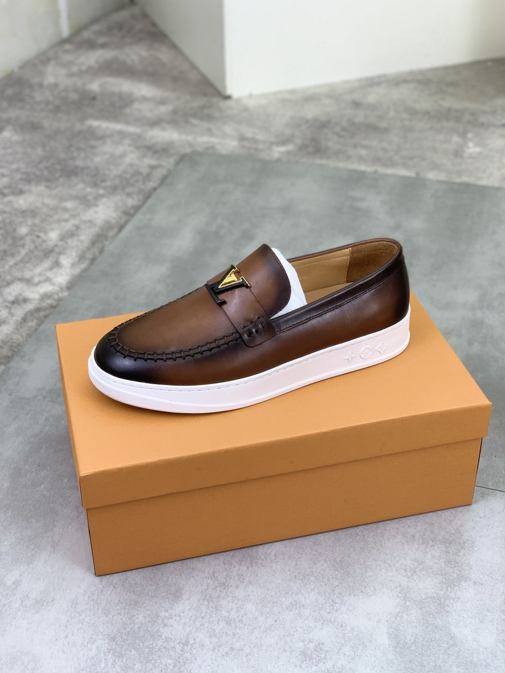 Louis Vuitton Metal Emblem Slip-On Loafers — front