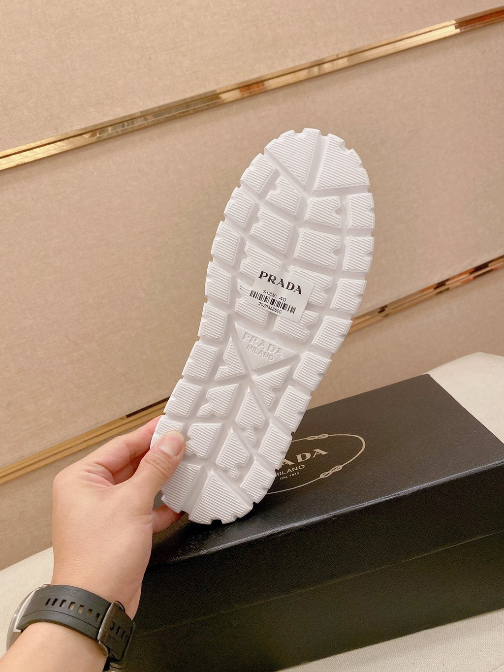 Prada Triangle Plaque Low-Top Sneakers — detail