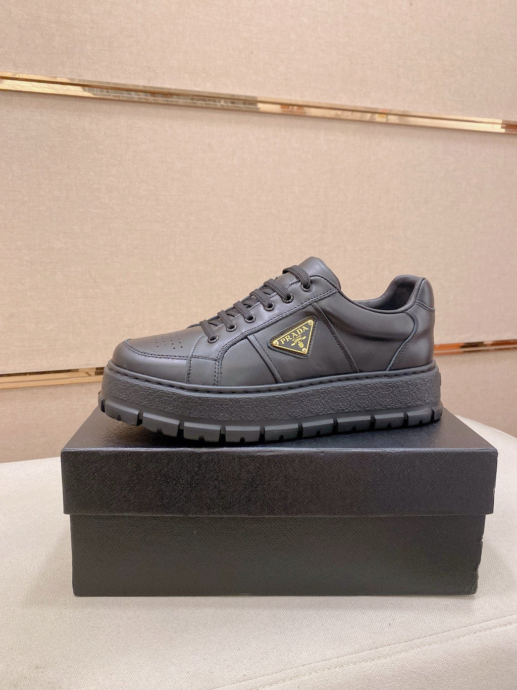 Prada Triangle Plaque Low-Top Sneakers — hero
