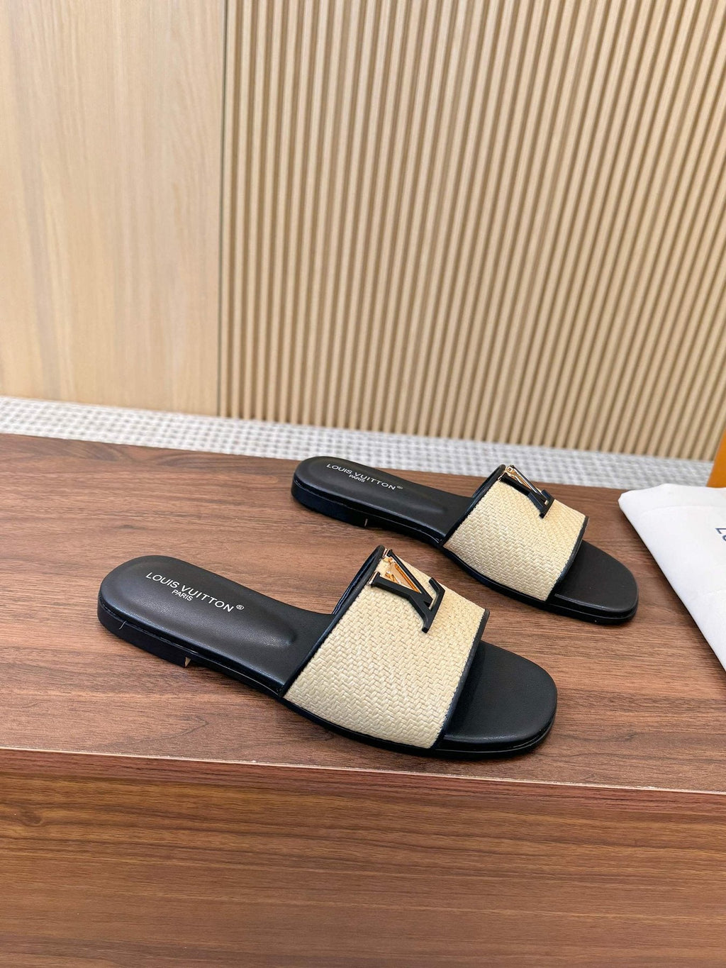 Louis Vuitton Textured Logo Slide Sandals — side
