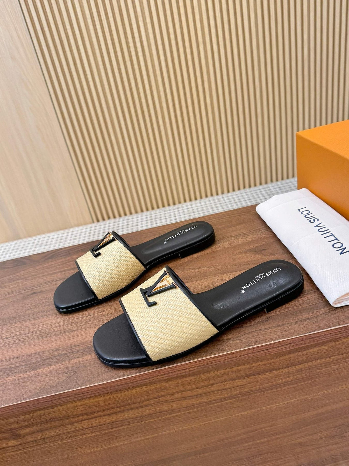 Louis Vuitton Textured Logo Slide Sandals — front