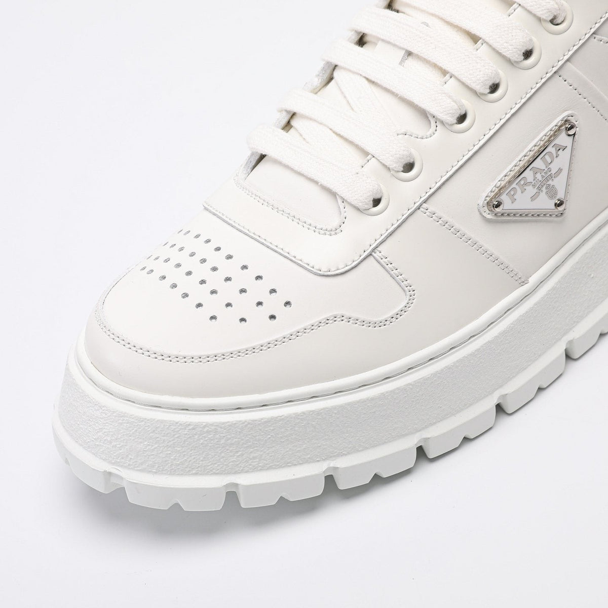 PRADA Triangle Plaque Low-Top Sneakers — detail