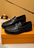 Louis Vuitton Embossed Buckle Loafers — hero