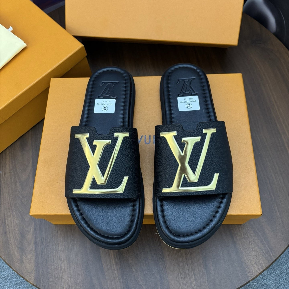 Louis Vuitton Raised-Monogram Slide Sandals — front