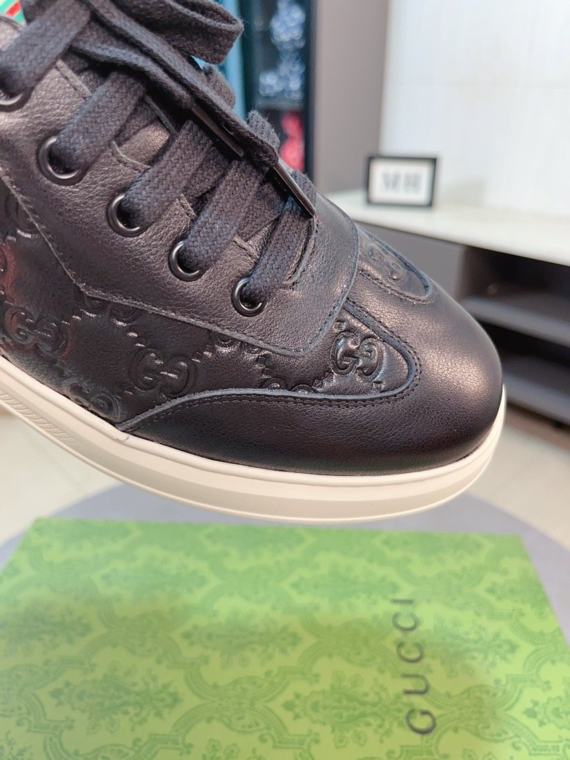 Gucci Embossed Low-Top Sneakers — detail