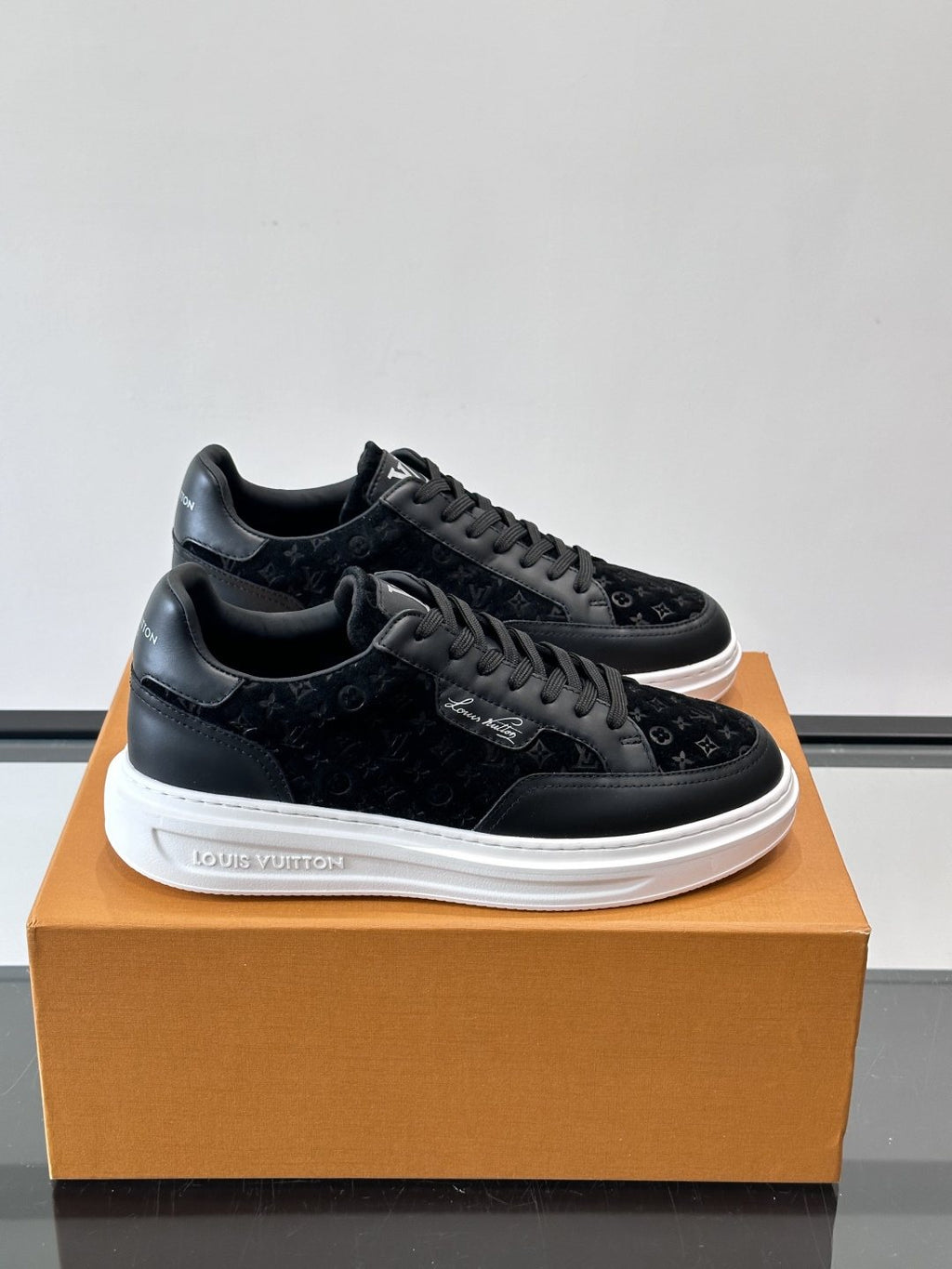 Louis Vuitton Embossed Low-Top Sneakers — front