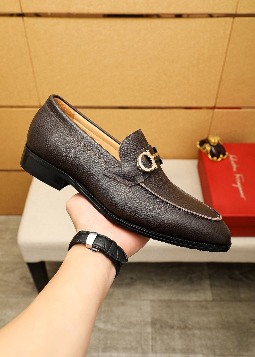 Ferragamo Pebble Leather Buckle Loafers — model