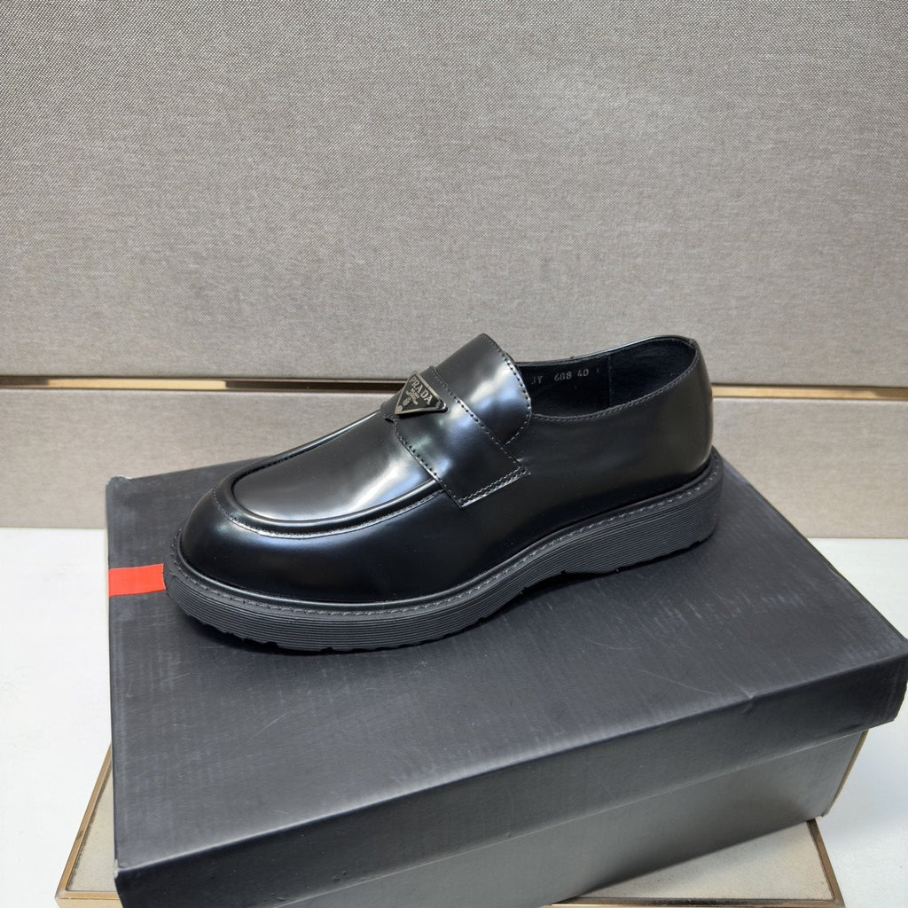 Prada Black Lug Sole Slip-On Shoes — front