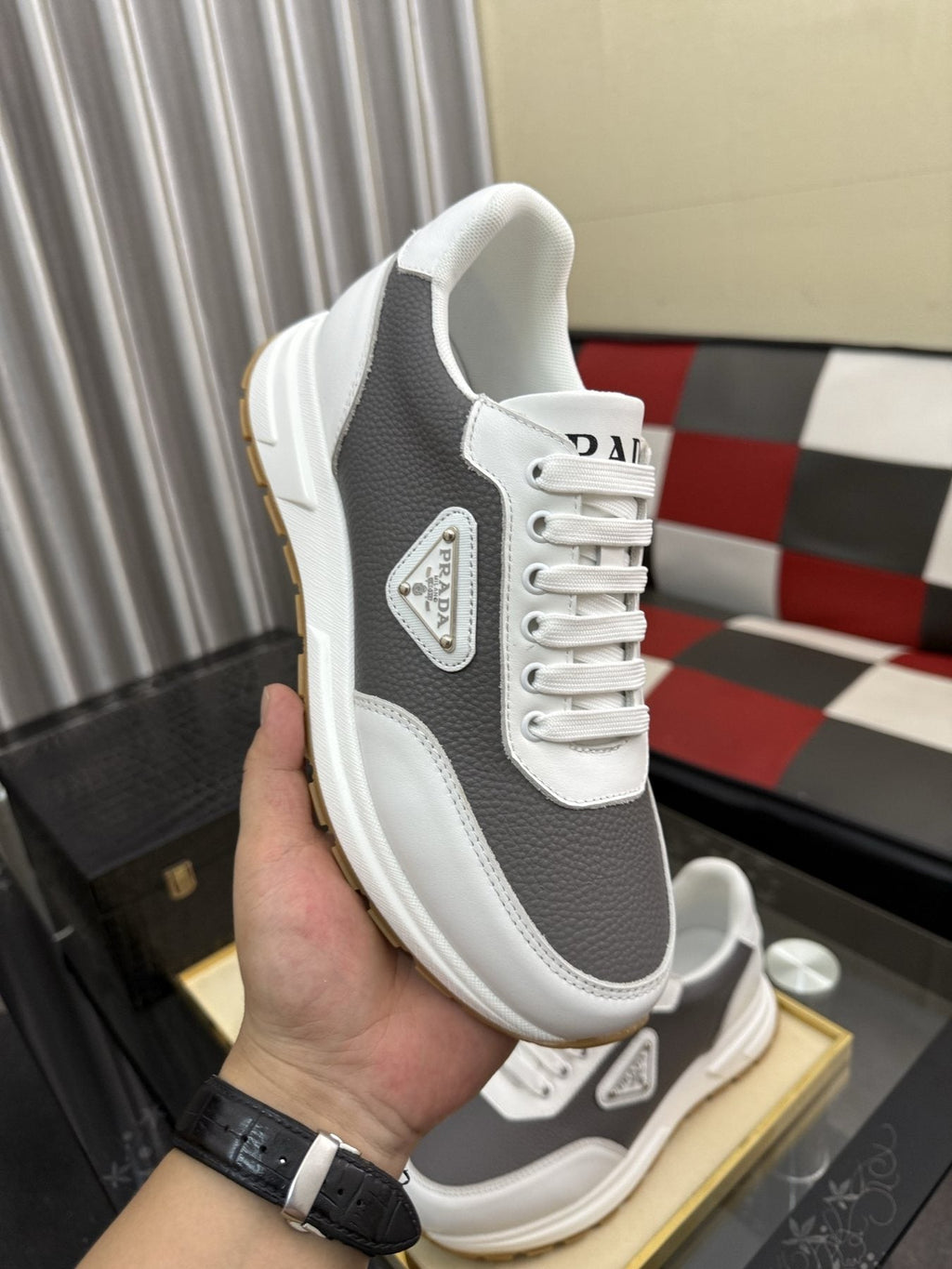 Prada Triangle Badge Low-Top Sneakers — model
