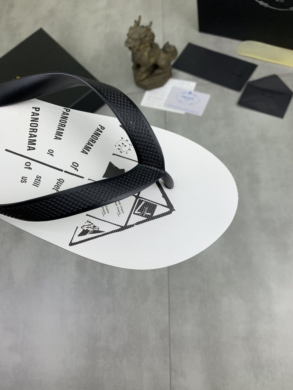 Prada Black Strap White Flip Flops — detail