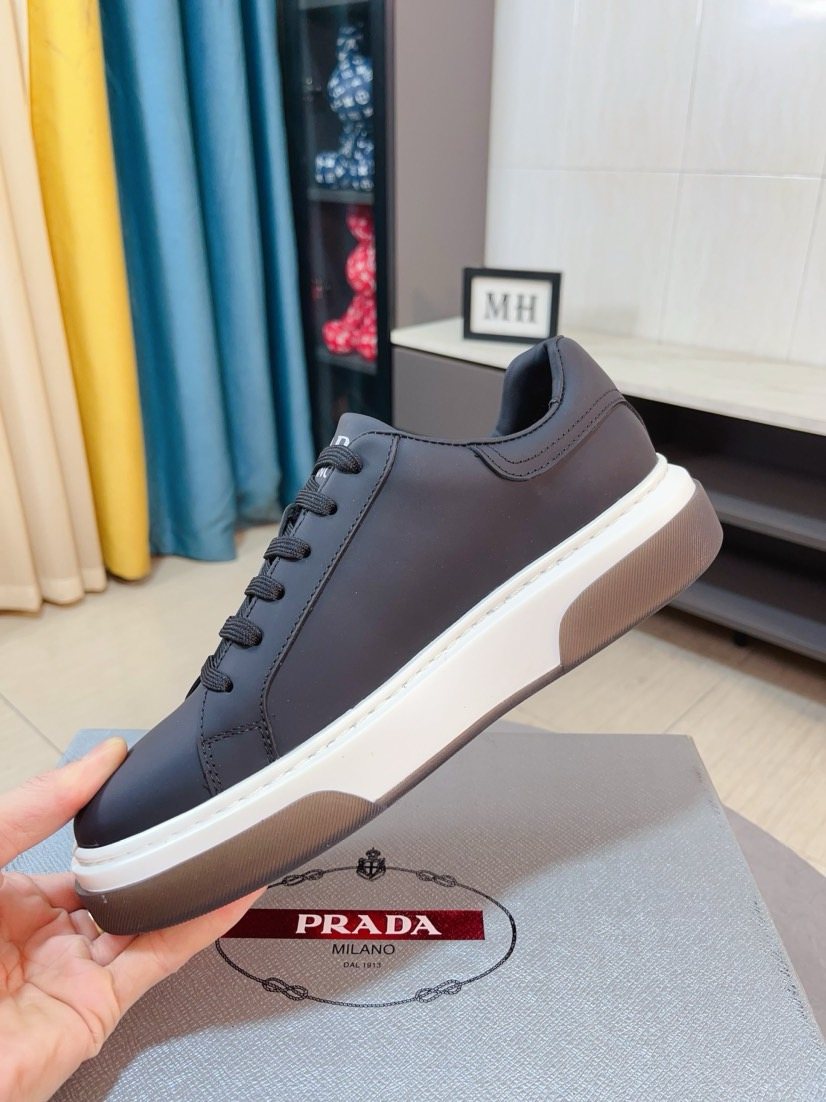 Prada Triangle Patch Low-Top Sneakers — model