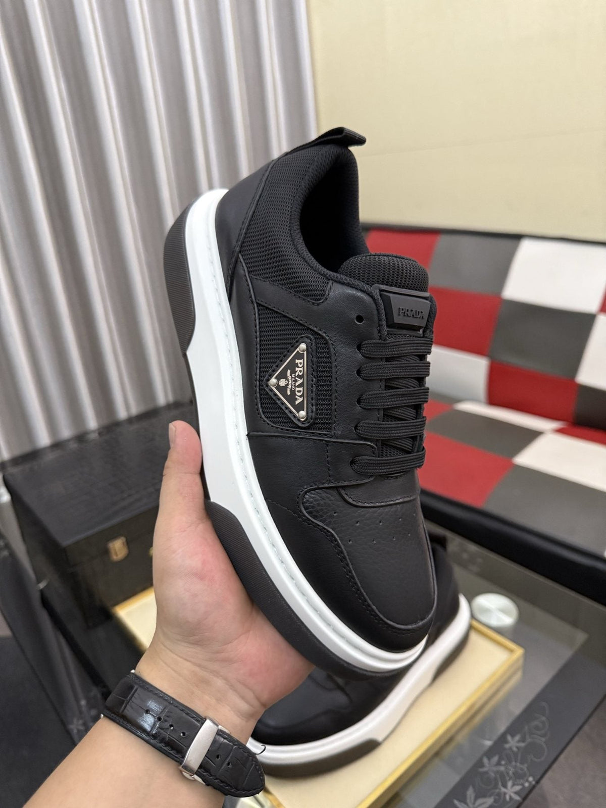 Prada Triangle Plaque Low-Top Sneakers — model