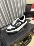 Prada Triangle Plaque Low-Top Sneakers — hero
