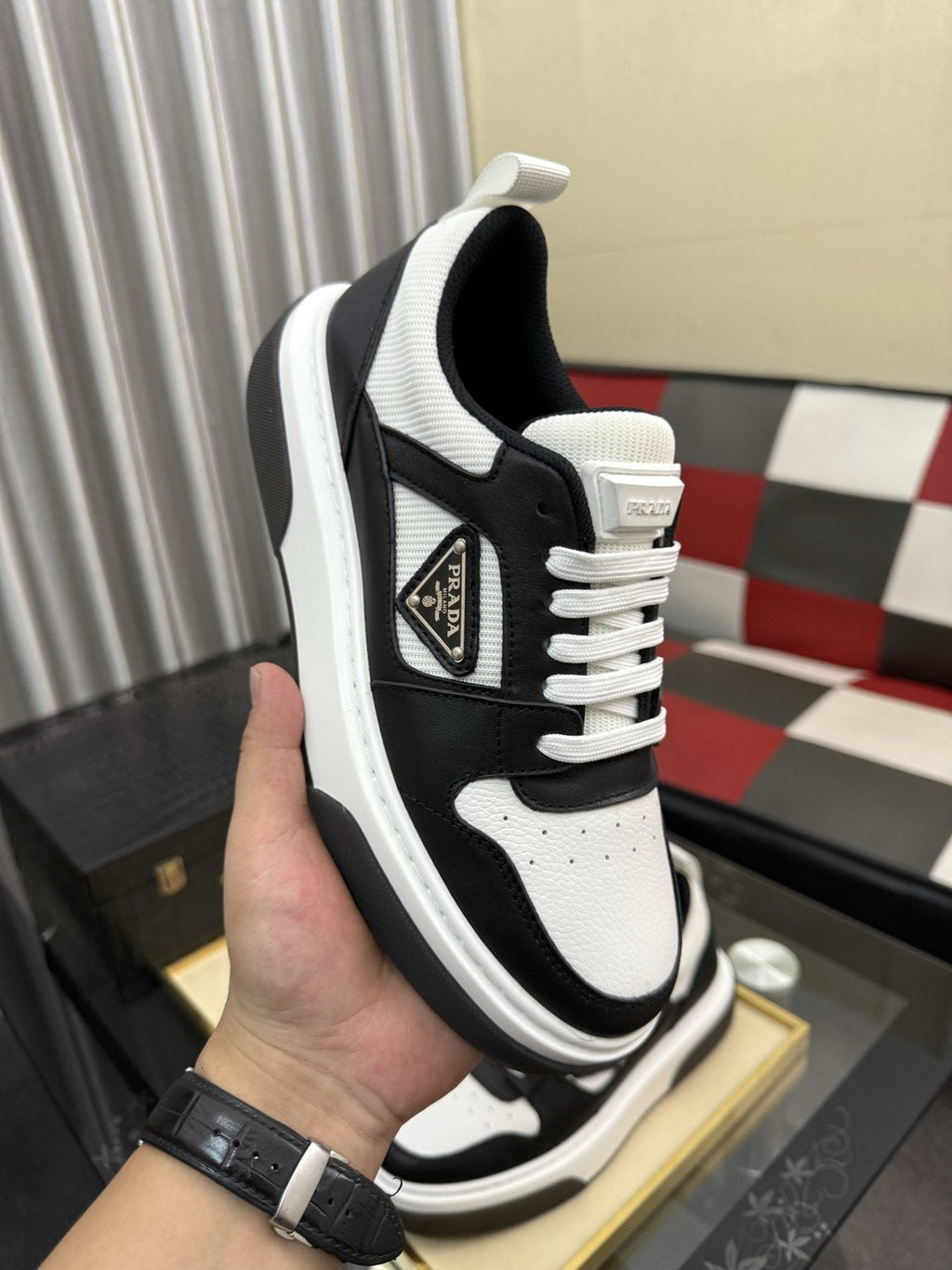 Prada Triangle Plaque Low-Top Sneakers — model