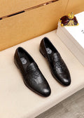 Versace Embossed Leather Slip-On Shoes — hero