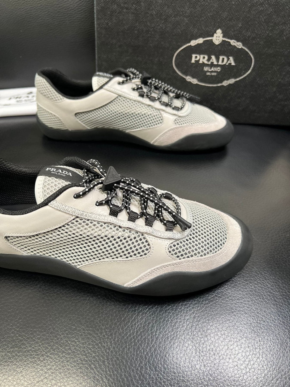 Prada White, Gray & Black Low-Top Sneakers — detail