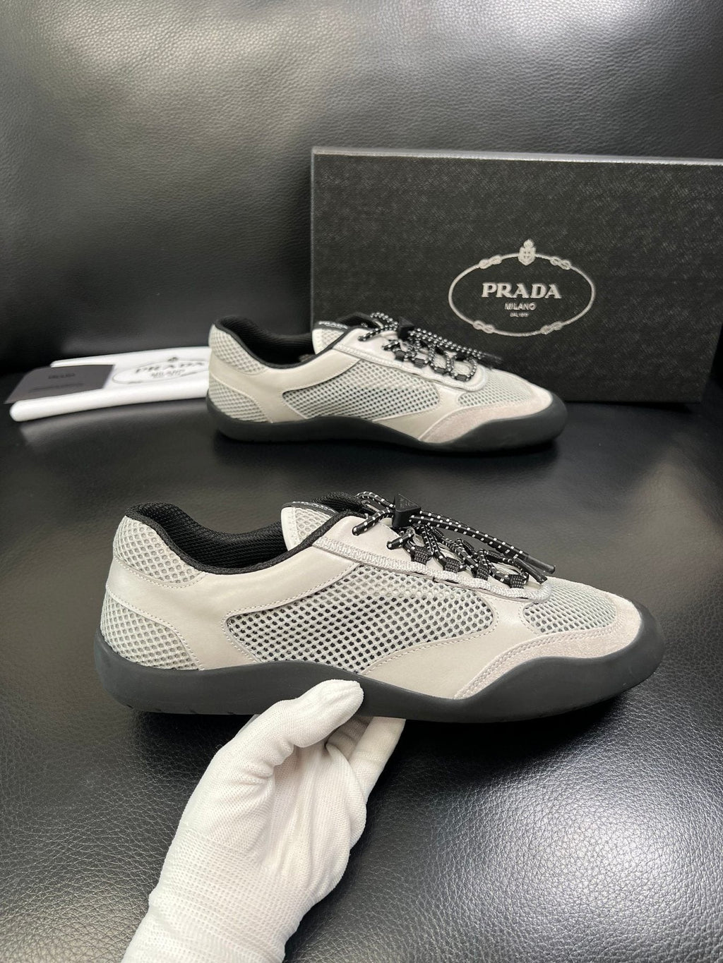 Prada White, Gray & Black Low-Top Sneakers — model