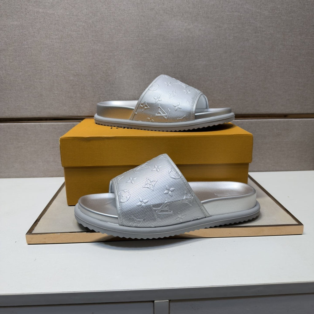 Louis Vuitton Embossed Metallic Slide Sandals — model